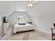 Bright bedroom with vaulted ceilings, large rug and rocking chair at 217 Springs Xing, Canton, GA 30114
