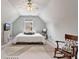 Bright bedroom with vaulted ceilings, large rug and rocking chair at 217 Springs Xing, Canton, GA 30114