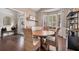 Inviting dining area with wainscoting, a bay window, and a chic bar area for casual gatherings at 217 Springs Xing, Canton, GA 30114