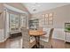 Bright dining area with a bay window, elegant wainscoting, and a stylish bar area for entertaining at 217 Springs Xing, Canton, GA 30114
