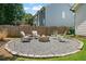 Nice firepit with a ring of stones, surrounded by gravel, and seating for many at 217 Springs Xing, Canton, GA 30114