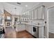 Contemporary kitchen with a stone accent wall, stainless steel appliances, and a sleek design for culinary enthusiasts at 217 Springs Xing, Canton, GA 30114