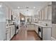 Modern kitchen with stainless steel appliances, granite countertops, and a seamless view into the dining area at 217 Springs Xing, Canton, GA 30114