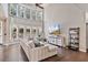Bright living room with high ceilings, large windows, and comfortable sectional sofa at 217 Springs Xing, Canton, GA 30114