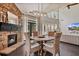Living area with stone fireplace, hardwood floors, and dining table at 217 Springs Xing, Canton, GA 30114