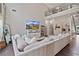 Bright living room with high ceilings, TV, and comfortable seating area at 217 Springs Xing, Canton, GA 30114