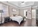 Main bedroom with wood floors, tray ceiling, ceiling fan, walk-in closet and natural light at 217 Springs Xing, Canton, GA 30114