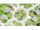 Aerial view of a neighborhood roundabout, showcasing community layout with lush greenery and landscaping at 2844 Bluestone Sw Dr, Atlanta, GA 30331
