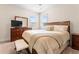 Comfortable bedroom with wood furnishings, neutral decor, and lots of natural light at 2844 Bluestone Sw Dr, Atlanta, GA 30331