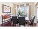 Formal dining room with elegant lighting, dark wood floors, and wainscoting at 2844 Bluestone Sw Dr, Atlanta, GA 30331