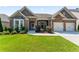 Charming single-story home with a brick facade, manicured lawn, and attached two-car garage at 2844 Bluestone Sw Dr, Atlanta, GA 30331