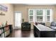 Inviting home office with natural light, desk, bookcase and hardwood floors at 2844 Bluestone Sw Dr, Atlanta, GA 30331