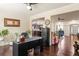 Open-concept office with hardwood floors that is connected to the kitchen, dining room, and living area at 2844 Bluestone Sw Dr, Atlanta, GA 30331