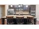 Modern kitchen featuring dark cabinets, stainless steel appliances, granite countertops and a center island with seating at 2844 Bluestone Sw Dr, Atlanta, GA 30331