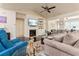 Spacious living room with a fireplace, built-in shelving, and comfortable seating at 2844 Bluestone Sw Dr, Atlanta, GA 30331