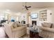 Spacious living room with a fireplace, built-in shelving, and open floor plan at 2844 Bluestone Sw Dr, Atlanta, GA 30331
