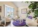 Bright living room featuring a bay window, hardwood floors, and comfortable seating at 2844 Bluestone Sw Dr, Atlanta, GA 30331