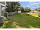 Spacious backyard offering ample green space with partial fence at 3835 Conley Downs Dr, Decatur, GA 30034