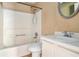 A functional bathroom featuring a tub-shower combination, commode, and vanity sink at 3835 Conley Downs Dr, Decatur, GA 30034