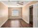 Neutral bedroom with modern ceiling fan, updated flooring, and natural light at 3835 Conley Downs Dr, Decatur, GA 30034