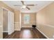 Neutral bedroom with ceiling fan, chair rail, and modern wood flooring at 3835 Conley Downs Dr, Decatur, GA 30034
