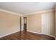 Spacious bedroom featuring wood-look floors and neutral walls for a comfortable and inviting space at 3835 Conley Downs Dr, Decatur, GA 30034