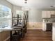 Bright dining area with wood floors, a chandelier, and access to kitchen area at 3835 Conley Downs Dr, Decatur, GA 30034