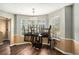 Bright dining area with wood floors, a chandelier, and ample natural light at 3835 Conley Downs Dr, Decatur, GA 30034
