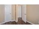 Hallway features multiple entryways, neutral walls, base trim and durable wood-look flooring at 3835 Conley Downs Dr, Decatur, GA 30034