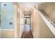 Inviting hallway with hardwood flooring and access to the home's main living areas at 3835 Conley Downs Dr, Decatur, GA 30034