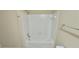 Bathroom featuring a white tile shower and tub combination at 5595 Marbut Rd, Lithonia, GA 30058