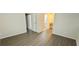 A bright bedroom with modern flooring and neutral walls and access to the bathroom at 5595 Marbut Rd, Lithonia, GA 30058