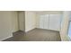 Bedroom with wood-look floors, a window, and a closet with sliding doors at 5595 Marbut Rd, Lithonia, GA 30058
