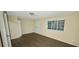Bedroom featuring vinyl flooring, closet, and natural light at 5595 Marbut Rd, Lithonia, GA 30058