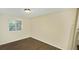 Bright, standard bedroom featuring wood floors and natural light, perfect for relaxation at 5595 Marbut Rd, Lithonia, GA 30058