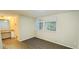 Bedroom featuring wood-look floors, natural light and vanity area at 5595 Marbut Rd, Lithonia, GA 30058