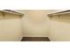 Walk-in closet with open shelving and wood look flooring at 5595 Marbut Rd, Lithonia, GA 30058