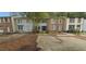 Inviting townhomes featuring distinctive entrances and convenient parking areas in a residential neighborhood at 5595 Marbut Rd, Lithonia, GA 30058
