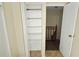 Hallway with a storage closet and view of the staircase at 5595 Marbut Rd, Lithonia, GA 30058