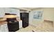 View of kitchen area with black appliances and neutral color scheme at 5595 Marbut Rd, Lithonia, GA 30058