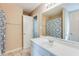 Bathroom featuring standard sink, large mirror and shower with decorative curtain at 179 Glynn Addy Dr, Stockbridge, GA 30281