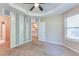 Bedroom with fan, window and doorway leading to kitchen and another bedroom at 179 Glynn Addy Dr, Stockbridge, GA 30281
