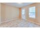 Bright bedroom features tile floors, natural light, and a private door at 179 Glynn Addy Dr, Stockbridge, GA 30281
