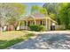 Well-maintained home features a tidy lawn and driveway, complementing the home's neutral exterior at 179 Glynn Addy Dr, Stockbridge, GA 30281