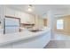 Bright kitchen boasts white cabinets, a breakfast bar, and modern appliances at 179 Glynn Addy Dr, Stockbridge, GA 30281