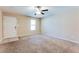 Inviting living room featuring tile flooring at the entryway, neutral walls, and a ceiling fan at 179 Glynn Addy Dr, Stockbridge, GA 30281