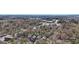 Picturesque neighborhood with tree-lined streets and a mix of residential and commercial properties at 2108 Main Nw St, Atlanta, GA 30318