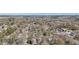Stunning aerial view of a residential neighborhood with mature trees and city skyline in the distance at 2108 Main Nw St, Atlanta, GA 30318