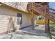 Stone patio with convenient access to upper decks, nestled along the side of the home at 2108 Main Nw St, Atlanta, GA 30318