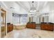 Large bathroom featuring double vanities, a soaking tub, and a glass shower at 2108 Main Nw St, Atlanta, GA 30318